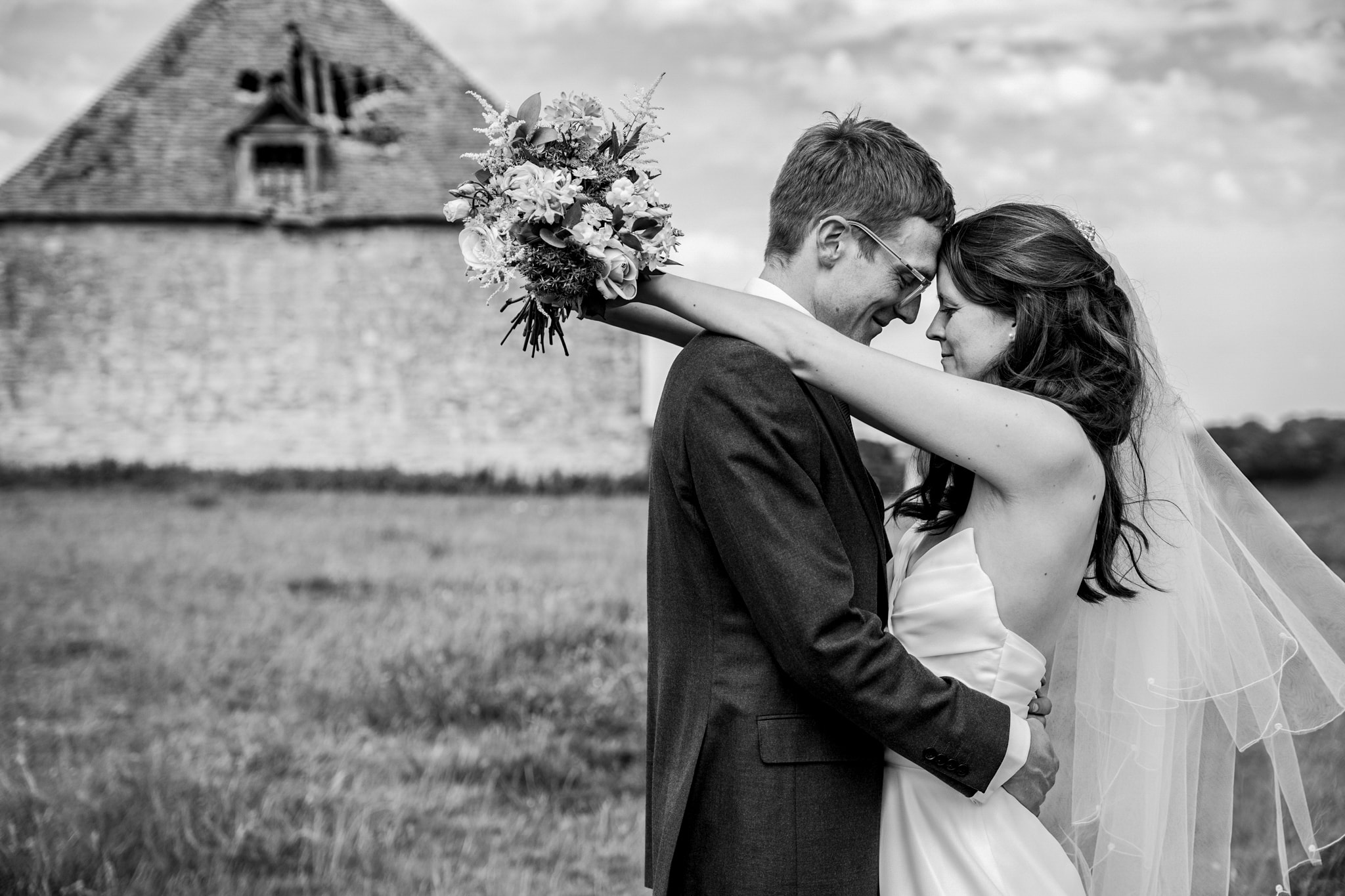 Black and white portrait of bride and groom at Notley Tythe Barn